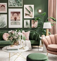 a living room with green walls and pictures on the wall above the couch, coffee table