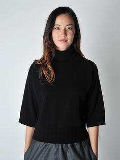 The Morris is a super chic Fall staple sweater featuring a classic fit, turtleneck and over the elbow sleeves. Modern and crisp. Styled with the Parts Pant and the Palau Pant. Model is five foot 8, size 4/6 and wearing a size S • 2 ply 70% wool, 30% cashmere• Made in Belgium Chic Cashmere Turtleneck, Elegant Turtleneck Sweater For Business Casual, Elegant Business Casual Turtleneck Sweater, Solid Cashmere Turtleneck For Workwear, Fall Cashmere Short Sleeve Sweater, Fall Cashmere Sweater With Short Sleeves, Fall Short Sleeve Cashmere Sweater, Fine Knit Turtleneck For Workwear, Modern Funnel Neck Turtleneck For Work