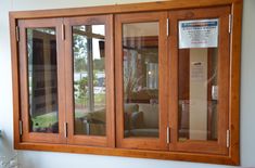 a wooden window with glass panels on the outside