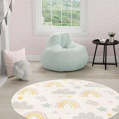 a child's room with pastel colors and rainbows on the wall, round bean bag chair