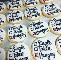 some cookies that have been decorated with the words single taken and two things on them