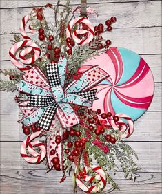 a candy cane wreath on a wooden table