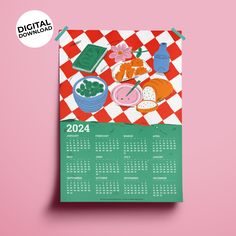 a calendar on a pink background with an image of food