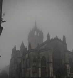 an old gothic church in the fog