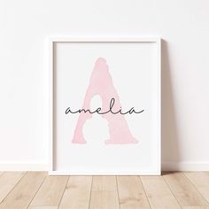 a pink and black print with the word amelie in cursive font