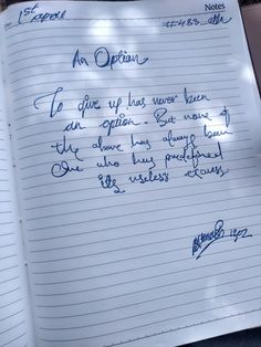 an open notebook with writing on it