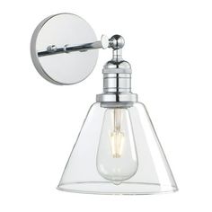 a chrome finish wall light with clear glass shade