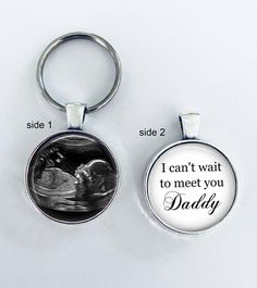 two key chains with the words i can't wait to meet you daddy