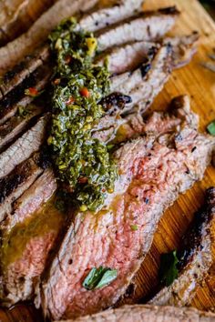 grilled steaks with pesto sauce on top