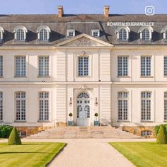 a large white building with lots of windows