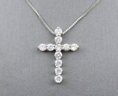 beautiful diamond cross pendant sku-4052cr setting information metal----------------10 karat white gold setting-----------------double share prong finish------------------high polish width------------------15.4 mm height-----------------21 mm simulated diamond information quantity----------------11 shape--------------round total weight------------1 carat Custom Orders: Please feel free to contact us if you could not find the piece you had in mind. We know how important it is to find the right je Gold Necklace Cross, Cross Gold Necklace, Cross Gold, Diamonds Necklace, Necklace Cross, Big Diamond, Plain Bands, Hand Ring, Diamond Cross Pendants