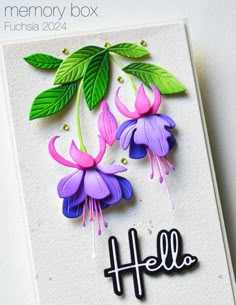 a card with some flowers and leaves on it