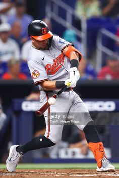 a baseball player swinging his bat during a game