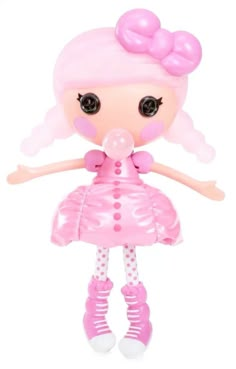 a pink doll with big eyes and long hair, holding a pacifier in her hand