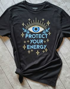 Evil Eye, Protect your Energy Gildan Soft Style Unisex Tees or Bella Canvas Ringspun tees Used. Size and color guides available in the photos section. Also available in tanks upon request. Font color can be changed. Just leave a note at checkout with the color you would like. Customization created using professional grade heat transfer vinyl adheared with a commercial grade heat press. Please leave the following information in the notes section at checkout: 1. Shirt Color Requested 2. Font Color Evil Eye Sublimation, Evil Eye Shirt Design, Iron On Shirt Ideas, Evil Eye Tshirt, Unisex Tshirt Design, Elegant Goth, Protection Energy, Spiritual Shirts, Protect Your Energy