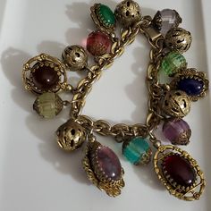 Etruscian Revival Style, Vintage Estate Stunning Charm Bracelet! This Has Tons Of Chunky True Jelly Belly And Lucite Faceted Beads With Figree Bead Caps, Gold Round Filigree Metal Beads, There Are Some Signed Unsigned Very Rare Napier Charm Bracelets Like This And Very Similar, I'm Not Sure If This Is By Napier But It's Very Possible And They Are Very Expensive! Over 300.00, There Were Several Simar And All Were Up In The $ On Different Designer Brands And Some From Italy, This Is Absolutely Stunning And The Estate Info Is That It's From The 50's. The Chunky Jelly Belly Beads Have Dimension And Are Double Sided. Beautiful Colors. This Is Approximately 7.5" And Can Eaisly Have A Few Jump R Belly Beads, Victorian Filigree, Jelly Belly, Tiffany And Co, Bead Caps, Metal Beads, Faceted Bead, Charm Bracelets, Designer Brands