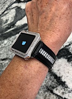 Fits the Apple Watch available for sizes 38,40,42 and 44mm in series 1,2,3,4,5,6 or SE. Look at the back of your watch for Both the correct millimeter size and series. Available to purchase together or individually. (Does not fit the white top ceramic version) This handmade Cz baguette Apple black leather Watch band and or the Bezel has Lab diamond baguette Bezel (can be purchase as a set or just the Crystal band)It is genuine leather and the stones are set in metal prongs and are channeled down Luxury Bling Watch Accessories For Gift, Luxury Embellished Watch Accessories For Gift, Luxury Silver Watch Bands With Bling, Luxury Silver Apple Watch Band, Baguette Band, Rose Gold Apple Watch, Apple Watch Leather, Gold Apple Watch, Diamond Baguette