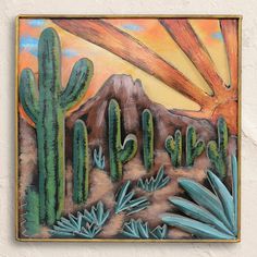 a painting on the wall of a desert with cactuses and mountains in the background