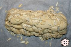 an uncooked dough with almonds on it