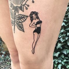 a woman with a tattoo on her leg