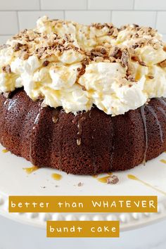 a bundt cake with whipped cream and nuts on top