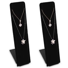 PRICES MAY VARY. 2 PCS SET NECKLACE STAND - Display up to 9 necklaces. The angle of the stand is adjustable to fit different heights of counters. NECKLACE JEWELRY DISPLAY - With the velcro on the back which allows you to adjust the length of chain with ease. JEWELRY DISPLAY STAND - Great for personal use at home, storefront, gallery, trade shows, fairs and different occasion. MATERIAL & SIZE - Black velvet; 2.75"W x3.5"D x 12"H; each. Accessories are NOT included. Product Details This display is Necklaces Holder, Display Necklaces, Chain Display, Necklace Jewelry Display, Necklaces Black, Velvet Necklace, Necklace Stand, Jewelry Display Stands, Necklace Holder