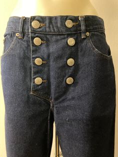 Women's vintage jeans circa 1990 by Gaultier. High-waisted blue jeans with naval-inspired front button detailing. Regular cut jeans with riveted classic pockets, inside change pocket, zipper, and button front closure. The waistband has belt loops. A Comfortable fit, straight leg. Good condition. Laundered. Vintage items do not always have labels and the sizes vary. Please check the measurements in the photos. All items are measured fully round, not flat. Vintage items may have minor flaws due to Sailor Style, 90s Jeans, Jean Vintage, Sailor Fashion, Telephone Number, Womens Jeans, Cut Jeans, Vintage Jeans, Blue Jeans