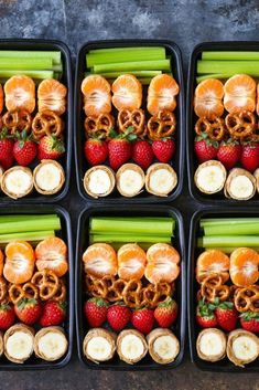 an image of some food that is in plastic containers with strawberries and celery