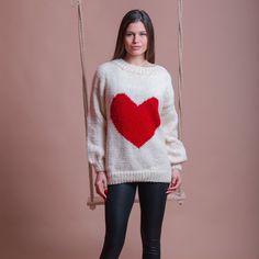 "White Wool Sweater, Red Heart Pullover, Valentine Sweater DETAILS - The sweater is made from Soft Pure Natural Wool Yarn - Made from 100% high quality wool /non colored wool / - The sweater is knitted 100 % Handmade - The model is 170 cm tall (regular S) - The sweater on picture is size XL - As mostly all models in our shop the sweater is loose fit - Colour on photo - red and cream FIT - The sweater is of loose fit designed to have comfortably roomy fit and look. For those who want loose - room Winter Sweater With Heart Graphic, Winter Heart Graphic Sweater, White Long Sleeve Sweater For Valentine's Day, Red Long Sleeve Sweater With Heart Print, Red Long Sleeve Sweater For Valentine's Day, Red Long Sleeve Valentine's Day Sweater, Red Heart Print Sweater For Valentine's Day, Red Heart-shaped Valentine's Day Sweater, White Wool Sweater