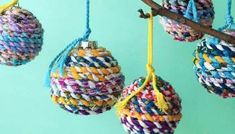 multicolored balls hanging from a tree branch