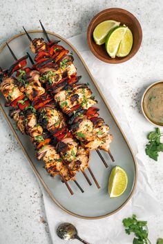 chicken kabobs on skewers with cilantro and lime