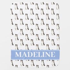 a white and blue dog pattern with the name madeline on it's back