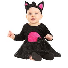 a baby girl wearing a black dress with pink heart on it's chest and ears