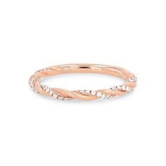 a rose gold ring with small diamonds on the inside and outside, set against a white background