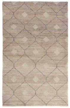 a beige rug with diamond shapes on it