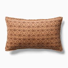 a brown pillow with an intricate pattern on it's back and the front is made out of cork