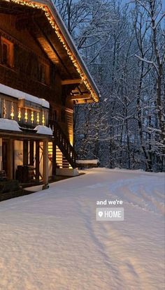 a house covered in snow with christmas lights