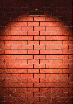 a red brick wall with a light shining on it's side in the middle