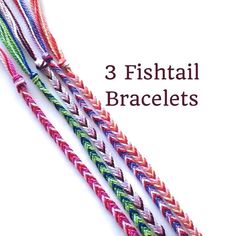 three fishtail bracelets with different colors and sizes are shown on the white background