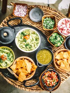 an array of different foods are arranged on a tray in the shape of a circle