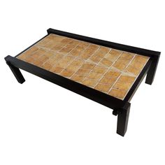 a coffee table made out of wood with tile on the top and bottom, sitting in front of a white background