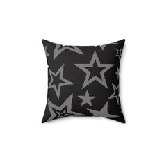 a black and white pillow with stars on it