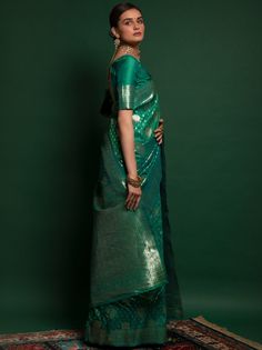 <ul>
<li>Presenting a gorgeous amalgamation of India's rich culture and tradition this unique green-colored silk saree is created with zari weaving all over the saree and also have thread zalar lace on the edge.</li>
<li>The saree arrives with a similar colored silk fabric half sleeve and V shape design blouse made up of zari weaving work.</li>
<li>This lovely green-colored silk saree is 5.50 meters long and comes with unstitched blouse material.</li>
&l Long Choli Lehenga, Angrakha Style, Saree Sale, Sea Green Color, Silk Weaving, Lehenga Wedding, Design Blouse, Festive Look, Wear Saree