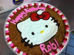 a hello kitty birthday cake with the name robi on it's icing