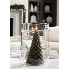 a small christmas tree in a glass jar