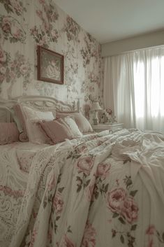 a large bed sitting next to a window in a room with floral wall paper on the walls