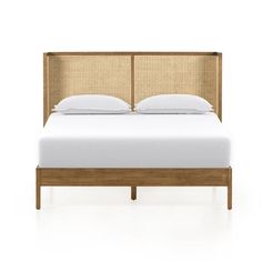 the headboard and foot board are made out of wood, with white sheets on it