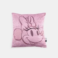 a pink mickey mouse pillow on a white background