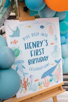 a sign that says dive deep into henry's first birthday celebration