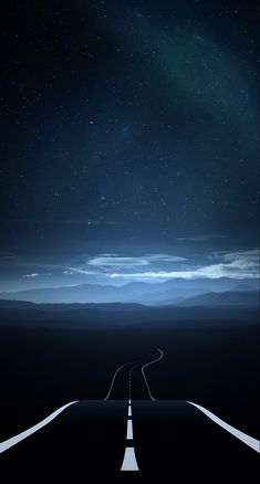 an empty road in the middle of nowhere under a night sky with stars and clouds